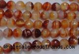CAG2701 15.5 inches 6mm faceted round red line agate beads