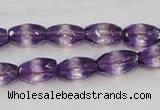 CSA25 15.5 inches 7*12mm faceted rice synthetic amethyst beads