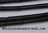 CTB318 15.5 inches 4*13mm tube black stone beads wholesale